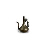 A bronze Ewer shaped Waterdropper, late Ming dynasty, of elegant plain form with slender neck and