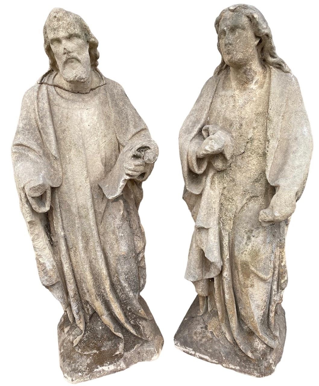A PAIR OF 18TH CENTURY CARVED LIMESTONE FIGURES OF JOSEPH AND MARY. (h 71cm)