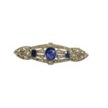 AN ART DECO WHITE METAL, DIAMOND AND SAPPHIRE BROOCH, WHITE METAL TESTED AS 18CT WHITE GOLD Having