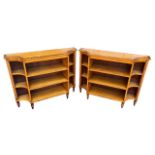 A PAIR OF REGENCY DESIGN BREAKFRONT SATINWOOD AND ROSEWOOD CROSSBANDED FLOOR STANDING BOOKCASE