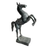 A LARGE CHINESE BRONZE HORSE REARING Raised on a rectangular base, having decorative geometric