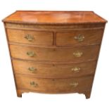 A 19TH CENTURY MAHOGANY BOW FRONTED CHEST OF TWO SHORT OVER THREE LONG GRADUATED DRAWERS Raised on