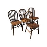 FOUR 19TH CENTURY ELM STICKBACK FARMHOUSE DINING CHAIRS The turned spindles above solid shaped seat,