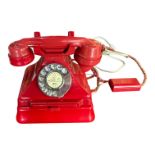 A 1950’S TYPE 232 SERIES RED BAKELITE TELEPHONE AND TERMINAL BOX Impressed marked no.164, p.l 36,