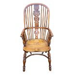 A YEW WOOD AND ELM WINDSOR CHAIR The pierced splat and turned spindles above solid shaped seat