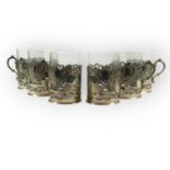 SIX MID 20TH CENTURY IRAQI/IRANIAN SILVER NIELLO TEA GLASS HOLDERS Having pieced body, Niello