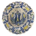 A LATE 17TH CENTURY DUTCH DELFTWARE PRINCE OF ORANGE LOBED CHARGER Painted in blue, green and yellow