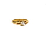 AN 18CT GOLD AND DIAMOND SOLITAIRE RING The central round old European cut diamond having a