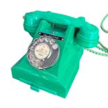 A 1950’S TYPE 300 SERIES GREEN BAKELITE TELEPHONE Impressed marks 164 - 54 to handset, exchange list