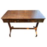 A 19TH CENTURY REGENCY DESIGN BURR WALNUT AND LINE INLAID TWO DRAWER LIBRARY TABLE Raised on twin
