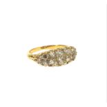 AN 18CT GOLD AND GRADUATED TWO ROW DIAMOND RING The round old European cut graduated diamonds with