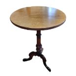 A VICTORIAN MAHOGANY AND ROSEWOOD OCCASIONAL TABLE The circular top raised on a turned column with