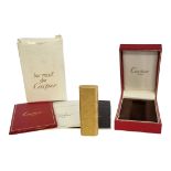 LES MUST DE CARTIER, A VINTAGE GOLD PLATED CYLINDRICAL CIGARETTE LIGHTER With textured finish,