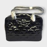 LULU GUINNESS, A LARGE LEATHER JENNY SHOULDER BAG Bblack patent leather bag with striped interior,