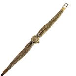 OMEGA, A VINTAGE 18CT GOLD AND DIAMOND LADIES’ COCKTAIL WATCH Circular silver tone dial with