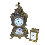 A 20TH CENTURY BRASS AND PORCELAIN MANTEL CLOCK Set with painted porcelain dial, together with a
