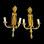 A PAIR OF 20TH CENTURY GILT BRONZE TWIN BRANCH WALL SCONCES Neoclassical shape applied with