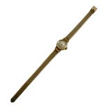 ROTARY, A VINTAGE 18CT GOLD LADIES’ WRISTWATCH Textured silver tone dial, on a gold plated strap. (