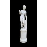 AFTER THE ANTIQUE, A HALF LIFE SIZE FAUX MARBLE STATUE OF VENUS With the apple, on a plinth base. (