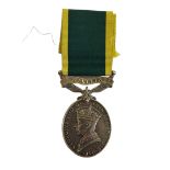 AN EARLY 20TH CENTURY SILVER TERRITORIAL ARMY EFFICIENCY MEDAL Having portrait of King George and