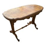 A VICTORIAN ART NOUVEAU PERIOD BURR AND FIGURED WALNUT CENTRE TABLE The cartouche top above a shaped