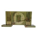 A MID CENTURY GREEN ONYX RECTANGULAR MANTLE CLOCK With gilt brass mounts, circular dial with