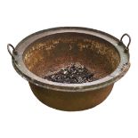 AN ANTIQUE CAST IRON CALDRON With two carrying handles. (67cm x 34cm) Condition: good overall,