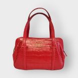 LULU GUINNESS, A MEDIUM RED LEATHER HANDBAG With croc skin design and monogrammed interior, complete