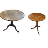 A 19TH CENTURY OAK OCCASIONAL TABLE The circular top raised on a ring turned column with three