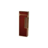 DUNHILL, A VINTAGE GOLD PLATE AND RED LACQUER RECTANGULAR CIGARETTE LIGHTER With hinged lid,