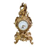 AN EARLY 20TH CENTURY FRENCH GILT METAL FIGURAL MANTLE CLOCK Organic form case with putti and