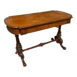 A VICTORIAN MAHOGANY CENTRE TABLE With two frieze drawers, raised on turned carved columns joined by