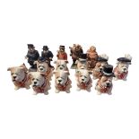 A SET OF TEN MANOR COLLECTABLES OF STAFFORDSHIRE PORCELAIN NOVELTY FIGURES OF SEATED BRITISH