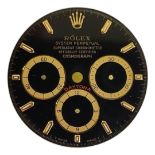 ROLEX, DAYTONA, A BLACK AND GOLD TONE COSMOGRAPH WATCH DIAL Having three subsidiary dials with