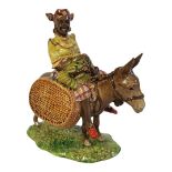 BESWICK, A 20TH CENTURY 'SUSIE JAMAICA' POTTERY FIGURE Female wearing traditional attire seated on a