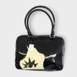 LULU GUINNESS, A PATENT LEATHER MARCEL WAVE DOLL FACE HANDBAG With black and white face and