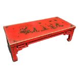 A 20TH CENTURY RED LACQUERED CHINESE CHINOISERIE DECORATED LOW COFFEE TABLE.