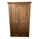AN EARLY 19TH CENTURY VICTORIAN STRIP AND WAXED PINE TWO DOOR HALL CUPBOARD. (h 210cm x d 37cm x w