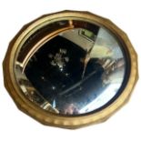 A LARGE EARLY 20TH CENTURY GILTWOOD CIRCULAR CONVEX MIRROR. (diameter glass 53.5cm, overall diameter