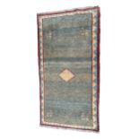 A VINTAGE PERSIAN GABBEH RUG With green ground and central diamond motif, surrounded stylise