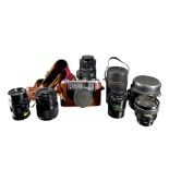 A VINTAGE CORFIELD PERIFLEX GOLD STAR FILM CAMERA TOGETHER WITH A COLLECTION OF FIVE CAMERA LENSES.