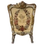 MANNER OF MOREL AND SEDDON, A 19TH CENTURY CARVED GILTWOOD PAINTED FIRE SCREEN Decorated with scr