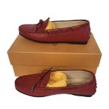 TOD’S, A PAIR OF LADIES’ RED LEATHER MOCASSINO SHOES Size 37½, with protective pouch, new in box.