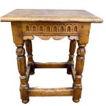 A 17TH CENTURY DESIGN CARVED OAK JOINT STOOL. (h 51cm x d 27cm x w 46.5cm)