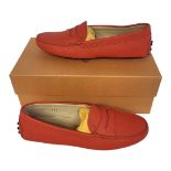 TOD’S, A PAIR OF LADIES’ ORANGE LEATHER MOCASSINO SHOES Size 37½, with protective pouch, new in box.