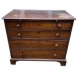 A GEORGE III MAHOGANY BACHELOR’S CHEST Of four long graduated drawers with brushing slid,. raised on