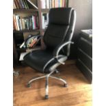 A BLACK LEATHER UPHOLSTERED DIRECTORS OFFICE CHAIR On chrome supports. (65cm x 62cm x 120cm)