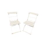 A PAIR OF 20TH CENTURY FRENCH WROUGHT IRON AND PAINTED WOOD FOLDING GARDEN CHAIRS.