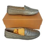 TOD’S, A PAIR OF LADIES’ GOLD LEATHER MOCASSINO SHOES Size 37½, with protective pouch, new in box.