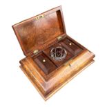 A 19TH CENTURY WALNUT SARCOPHAGUS TOP TEA CADDY Opening to reveal a fitted interior and glass mixing